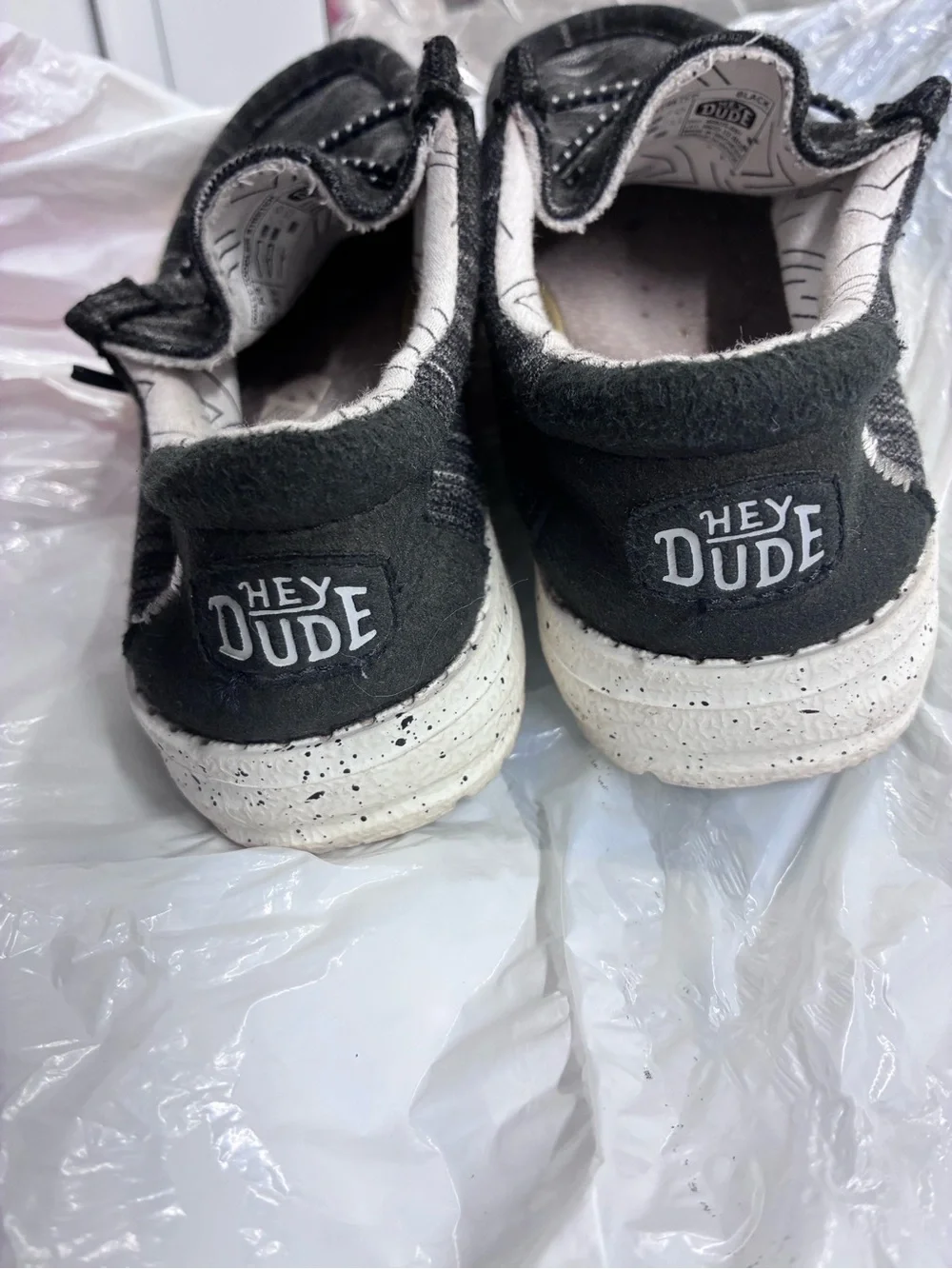 Hey Dude Black Slip-On Sneakers with White Speckled Soles